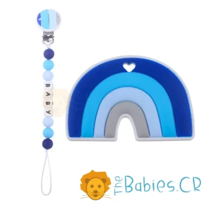 mordedor_de_arcoiris_color_turquesa_con_sujetador_de_chupeta_denticion_silicon_dientes_thebabiescr